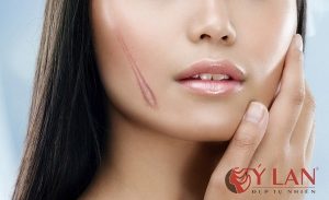 Beauty woman Face and hand touch her face isolated on white background for skin care concept, model is a beautiful asian girl